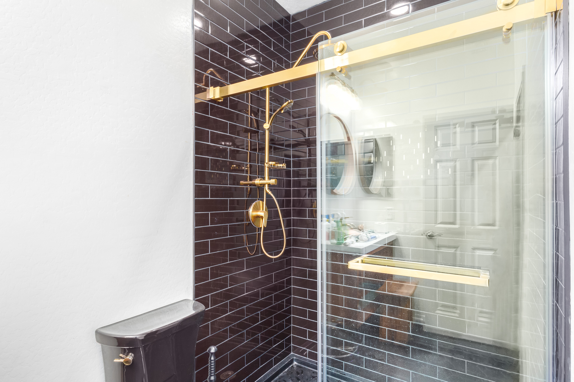 Contemporary shower black subway tile